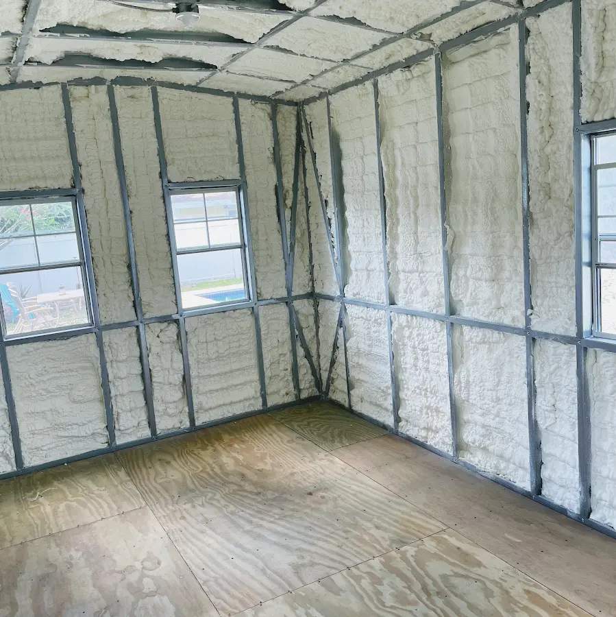 Closed-cell spray foam insulation applied to wall cavities in a residential project in Mason